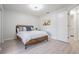 Bedroom with queen-size bed and access to laundry room at 2582 Bentley Dr, Palm Harbor, FL 34684