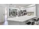 Modern kitchen with white cabinets, stainless steel appliances, and quartz countertops at 2582 Bentley Dr, Palm Harbor, FL 34684