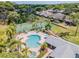 Community pool with spa and tennis courts at 2582 Bentley Dr, Palm Harbor, FL 34684
