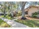 Charming house exterior with mature landscaping at 2582 Bentley Dr, Palm Harbor, FL 34684
