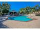 Relaxing community pool with patio and lounge chairs at 2582 Bentley Dr, Palm Harbor, FL 34684
