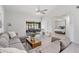 Bright living room with sectional sofa and view of bedroom and patio at 2582 Bentley Dr, Palm Harbor, FL 34684