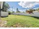Large backyard with grassy area and privacy fence at 2582 Bentley Dr, Palm Harbor, FL 34684