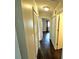 Light and bright hallway with dark wood floors and neutral walls at 2917 Lichen Ln # D, Clearwater, FL 33760