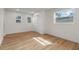 This well-lit bedroom features wood floors, a large window and ample closet space at 3612 W Leila Ave, Tampa, FL 33611