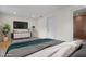 Spacious bedroom featuring modern furniture and a large TV, perfect for relaxing and enjoying your favorite shows at 3612 W Leila Ave, Tampa, FL 33611