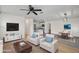 Bright living room with modern decor, an open floor plan, and seamless access to dining and kitchen areas at 3612 W Leila Ave, Tampa, FL 33611