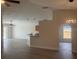 Open living space with an island, new flooring, and access to the backyard at 4611 Horseshoe Pick Ln, Valrico, FL 33594
