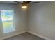 Bright bedroom with window, ceiling fan, and closet at 4611 Horseshoe Pick Ln, Valrico, FL 33594