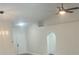 Open concept living area with vaulted ceilings, recessed lighting, and double doors at 4611 Horseshoe Pick Ln, Valrico, FL 33594