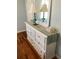 White dresser with mirror and ample storage in bedroom at 5407 29Th S Ave, Gulfport, FL 33707