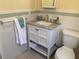 Clean bathroom with white vanity, marble countertop and tiled walls at 5407 29Th S Ave, Gulfport, FL 33707