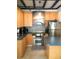 Modern kitchen with stainless steel appliances and wood cabinets at 5407 29Th S Ave, Gulfport, FL 33707