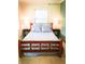 Primary bedroom with wooden bed frame and blue and white bedding at 5407 29Th S Ave, Gulfport, FL 33707