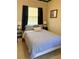 Bright bedroom with blue and white striped bedding and bedside tables at 5407 29Th S Ave, Gulfport, FL 33707