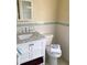 Updated bathroom with white vanity, marble countertop and tiled shower at 5407 29Th S Ave, Gulfport, FL 33707
