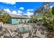 Private backyard with patio furniture and gravel at 5407 29Th S Ave, Gulfport, FL 33707