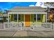 Charming yellow cottage with white porch and picket fence at 5407 29Th S Ave, Gulfport, FL 33707