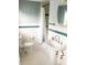 Clean bathroom with pedestal sink, shower, and hexagon tile floor at 5407 29Th S Ave, Gulfport, FL 33707