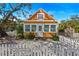 Charming yellow cottage with white picket fence and mature tree at 5407 29Th S Ave, Gulfport, FL 33707