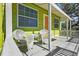 Relaxing front porch with white wicker chairs at 5407 29Th S Ave, Gulfport, FL 33707