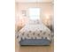 Guest bedroom with seashell bedding and nightstands with lamps at 5407 29Th S Ave, Gulfport, FL 33707