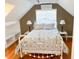 Charming bedroom with white iron bed and built-in shelving at 5407 29Th S Ave, Gulfport, FL 33707