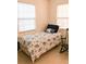 Small bedroom with seashell bedding and a rocking chair at 5407 29Th S Ave, Gulfport, FL 33707