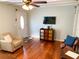 Living room with hardwood floors and a TV at 5407 29Th S Ave, Gulfport, FL 33707