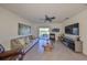 Spacious living room featuring tile floors, ceiling fan, and comfortable seating at 16910 Trite Bend St, Wimauma, FL 33598