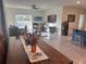 Spacious living room with access to backyard patio at 16910 Trite Bend St, Wimauma, FL 33598