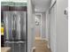 Hallway with stainless steel refrigerator and built-in closet at 205 5Th N Ave # 202, St Petersburg, FL 33701