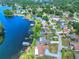 Aerial view of lakefront homes and community at 3042 Lake Saxon Dr, Land O Lakes, FL 34639