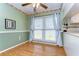 Light and airy dining area with large window and wood flooring at 3042 Lake Saxon Dr, Land O Lakes, FL 34639