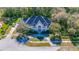 Home with driveway and landscaping in an aerial view at 3073 Woodsong Ln, Clearwater, FL 33761