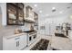 Modern kitchen with marble countertops, stainless steel appliances, and white cabinetry at 3073 Woodsong Ln, Clearwater, FL 33761