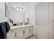 Bathroom with a quartz countertop and large mirror at 3073 Woodsong Ln, Clearwater, FL 33761