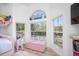 Charming bedroom with large windows and playful decor at 3073 Woodsong Ln, Clearwater, FL 33761