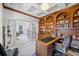 Spacious home office with wooden built-ins and view to living area at 3073 Woodsong Ln, Clearwater, FL 33761