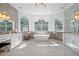 Luxurious bathroom features a freestanding tub, dual vanities, and large windows at 3073 Woodsong Ln, Clearwater, FL 33761