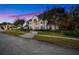Elegant two-story home with a charming facade and landscaping at 3073 Woodsong Ln, Clearwater, FL 33761