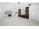 Bright living room with marble floors and built-in shelving at 3073 Woodsong Ln, Clearwater, FL 33761