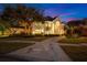 Stunning two-story home with a grand entrance and manicured landscaping at 3073 Woodsong Ln, Clearwater, FL 33761