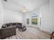 Bright sitting area with large windows and a comfy sectional sofa at 3073 Woodsong Ln, Clearwater, FL 33761