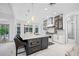 Spacious kitchen island with marble countertops and breakfast bar seating at 3073 Woodsong Ln, Clearwater, FL 33761