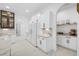 White kitchen with built in appliances and pantry at 3073 Woodsong Ln, Clearwater, FL 33761