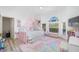 bedroom with whimsical decor and abundant natural light at 3073 Woodsong Ln, Clearwater, FL 33761