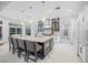 Gourmet kitchen boasts modern appliances and spacious island with seating at 3073 Woodsong Ln, Clearwater, FL 33761