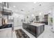 Island kitchen with marble countertops and dark wood cabinets at 3073 Woodsong Ln, Clearwater, FL 33761