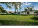 Large backyard with lush lawn and modern home at 3165 Renatta Dr, Belleair Bluffs, FL 33770